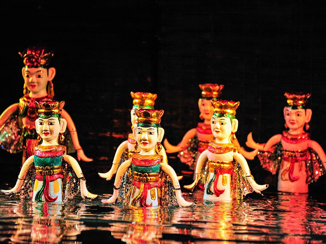Water Puppetry Performance - Vibrant Scene and Sounds